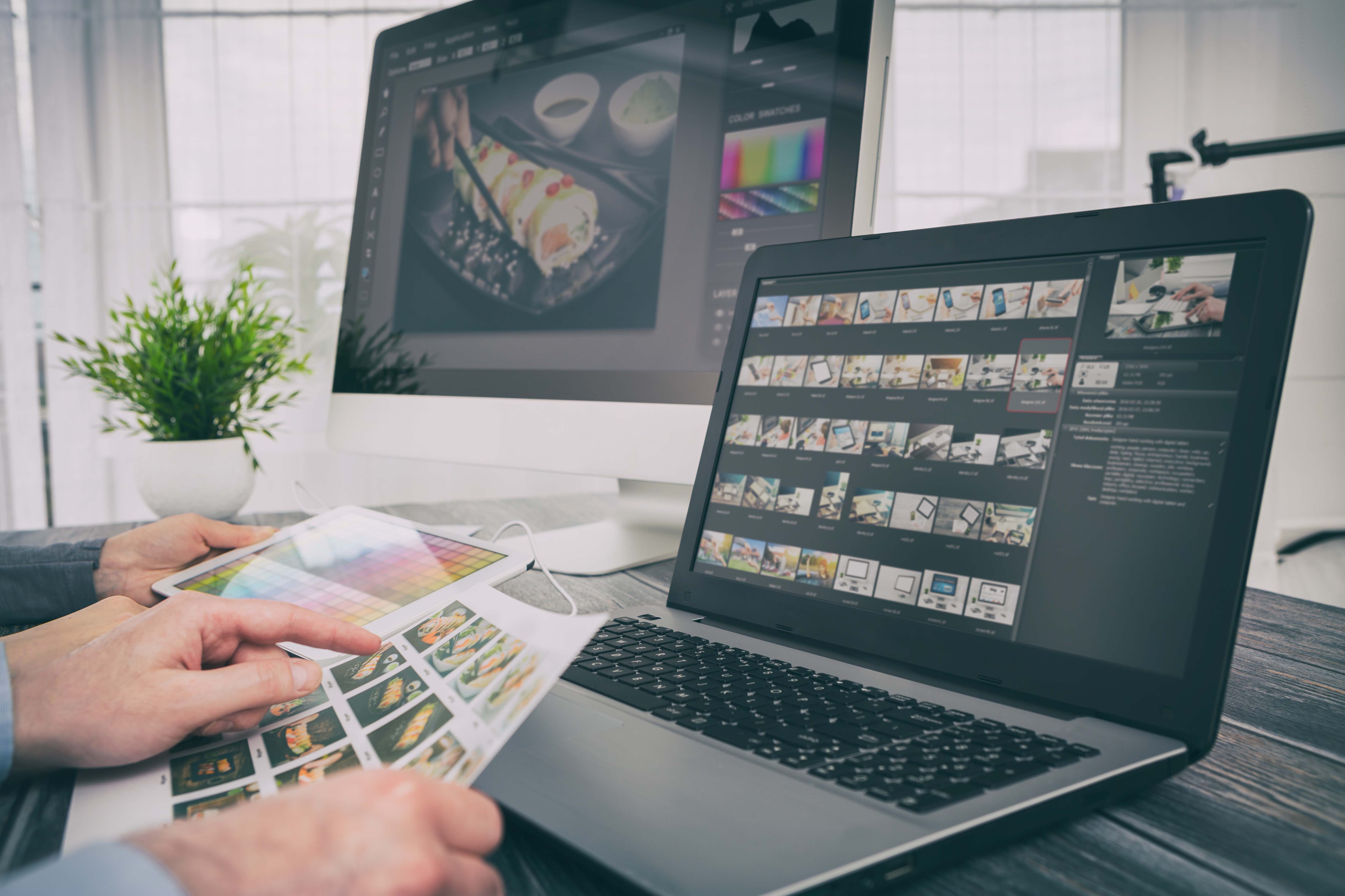 graphic Designers collaborating on sushi photo on a computer